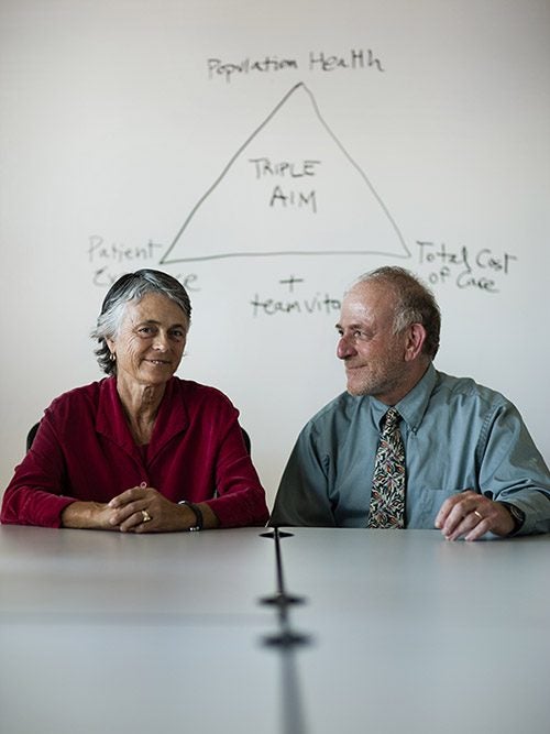 Ann and Alan Glaseroff sitting next to each other, smiling.