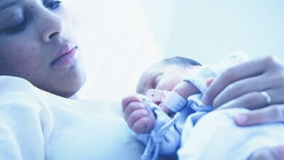 Mother holding newborn baby