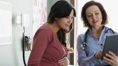 Pregnant woman consults with provider