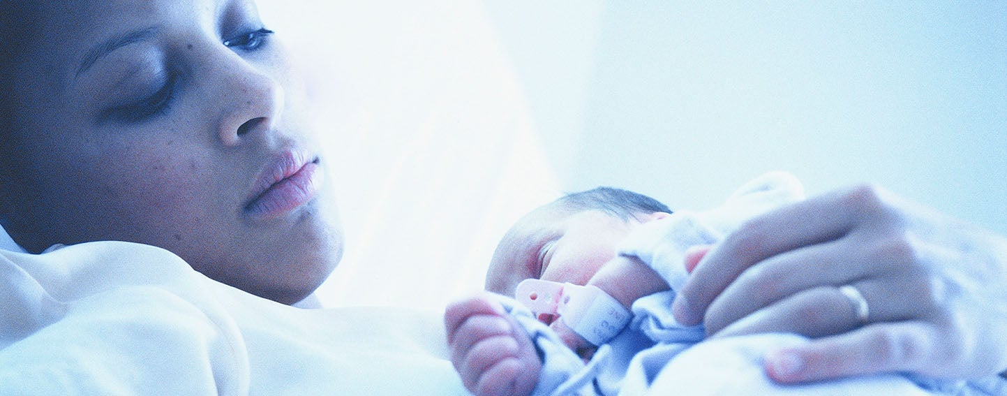 Mother holding newborn baby