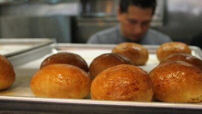Cooks making bread at DV8, a restaurant that hires only people recovering from substance use disorders.