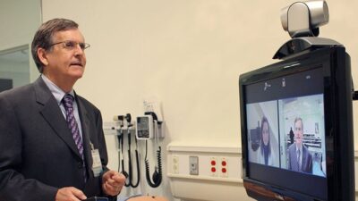 Dr Nesbitt on telehealth video conference
