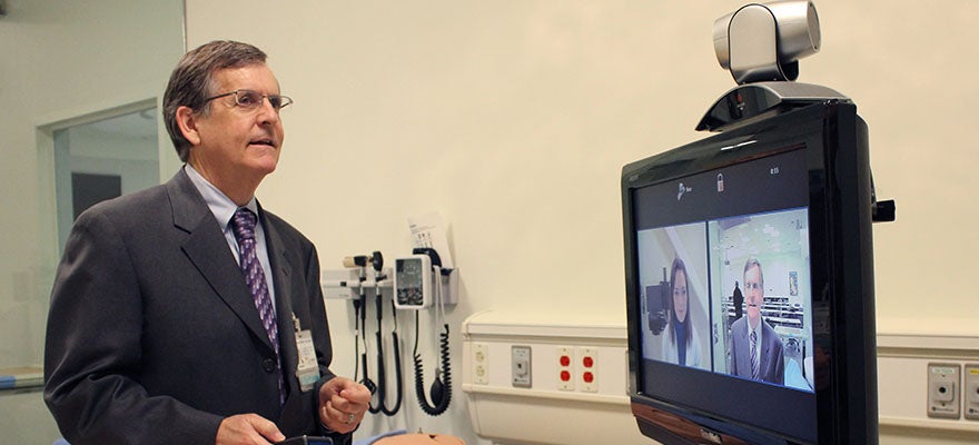 Dr Nesbitt on telehealth video conference
