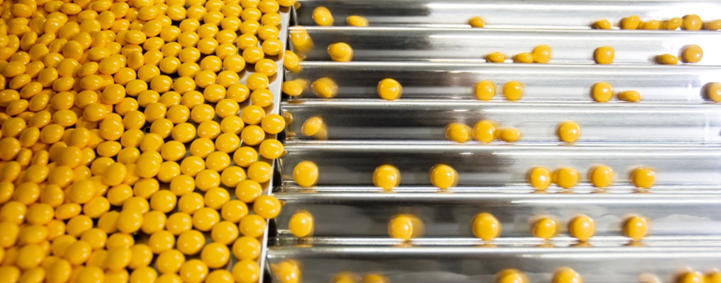 yellow pills at a pharmaceutical production company