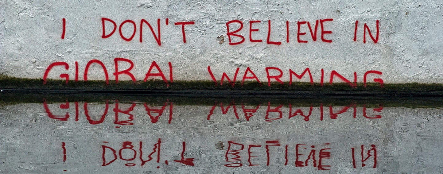 Banksy grafitti "I don't believe in global warming"