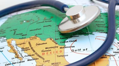 a stethoscope is draped over a globe shoing a map of the United States