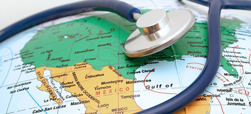 a stethoscope is draped over a globe shoing a map of the United States