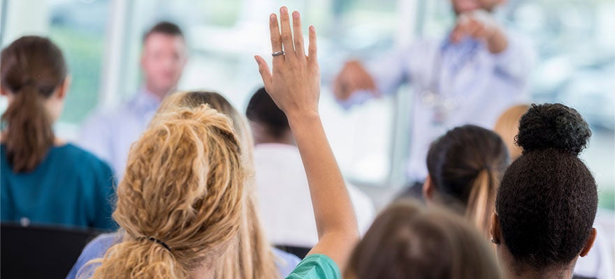 health care provider raised hand during training class
