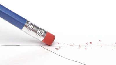 pencil erasing a line on white paper and redrawing it in a lower position