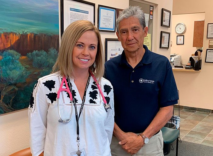 Christy Smith, NP, and Joseph Quintana, MD stand in the reception area of Valley-Wide Health System's clinic in San Luis Colorado