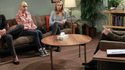 Characters from the Mom television series participate in a group therapy session.