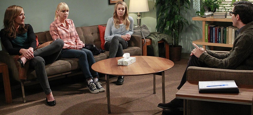 Characters from the Mom television series participate in a group therapy session.