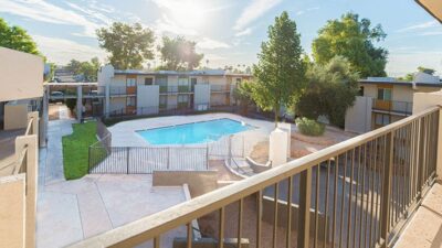 Apartment complex with swimming pool on a sunny day