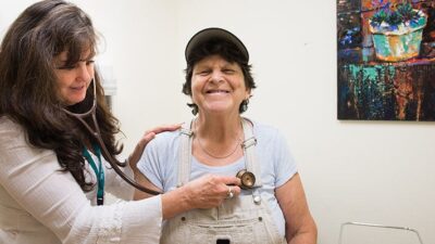 doctor examines patient in a clinic
