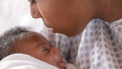 Mother with newborn baby in hospital.