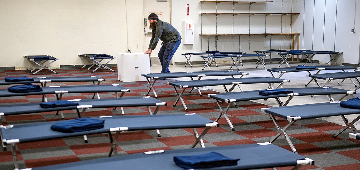 Paul Duncan readies a Salvation Army thrift store to house homeless people.