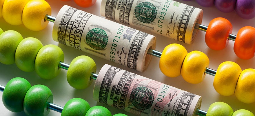 Colorful abacus with dollars wrapped around some of the wires