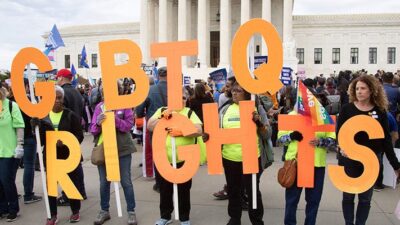 Gay and transgender activists spell out ''LGBTQ RIGHTS'' as the U.S. Supreme Court heard oral arguments in cases dealing with workplace discrimination based on sexual orientation