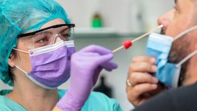 COVID-19 nasal swab test is administered at doctors office