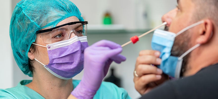 COVID-19 nasal swab test is administered at doctors office