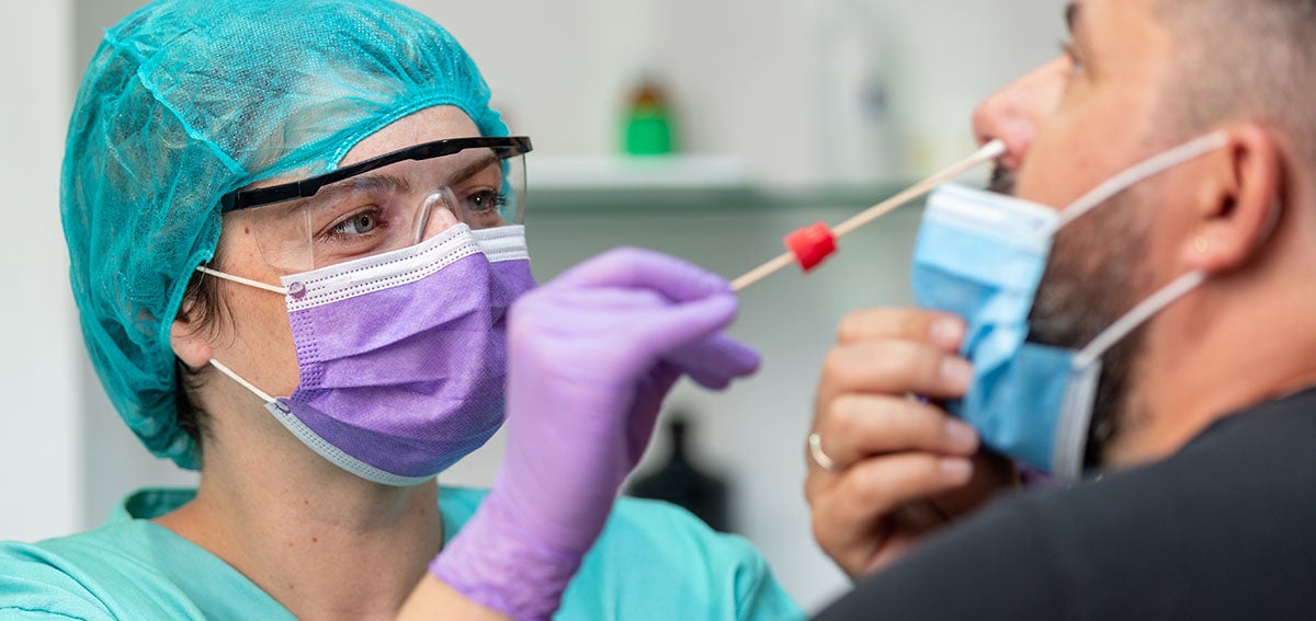 COVID-19 nasal swab test is administered at doctors office