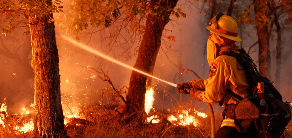 A firefighter crew from Humboldt County battles a fierce wildfire in Napa County