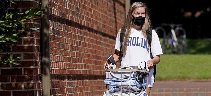 Student leaves campus following a cluster of COVID-19 cases at the University of North Carolina in Chapel Hill