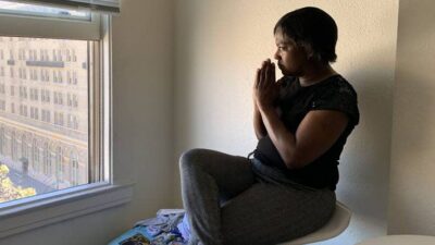 Sonja Summerville Trotter looks out the window in her new studio apartment in downtown Oakland