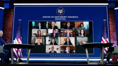 President-elect Joe Biden and Vice President-elect Kamala Harris listen during a meeting with Biden's COVID-19 advisory council
