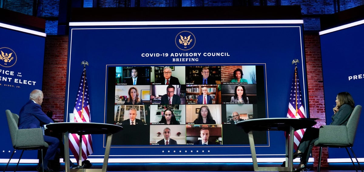 President-elect Joe Biden and Vice President-elect Kamala Harris listen during a meeting with Biden's COVID-19 advisory council