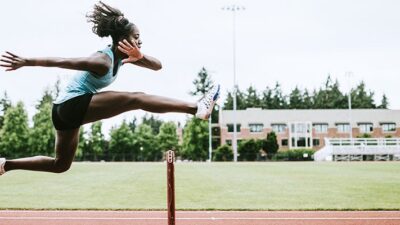 Runner leaping over a hurdle