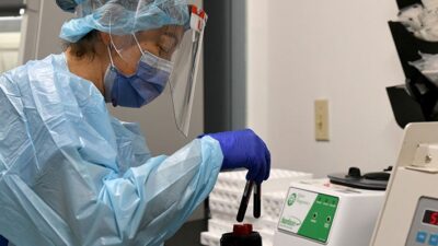 Sendy Puerto processes blood samples for COVID-19 vaccine development