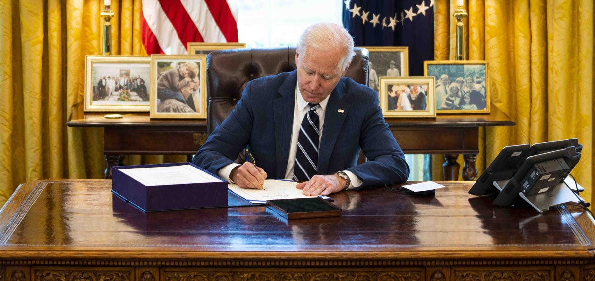 President Joe Biden signs the American Rescue Plan