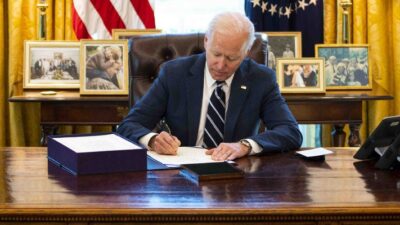 President Joe Biden signs the American Rescue Plan