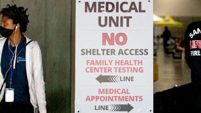 Health care workers at the San Diego Convention Center COVID-19 shelter for people experiencing homelessness