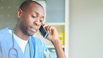 Doctor conducting a telehealth visit by phone