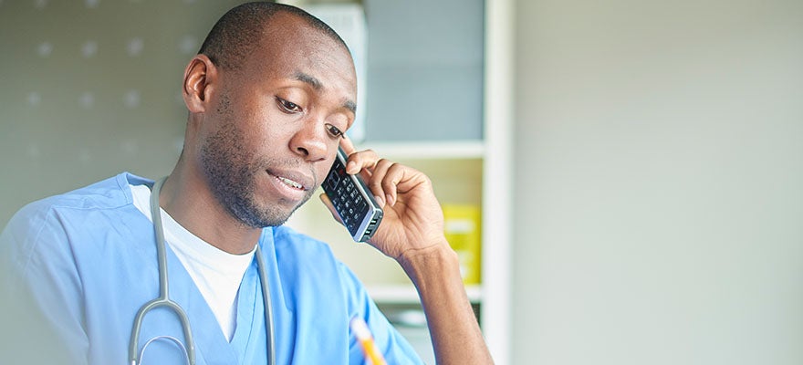 Doctor conducting a telehealth visit by phone