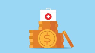 Illustration of medical first aid kit sitting on a pile of coins