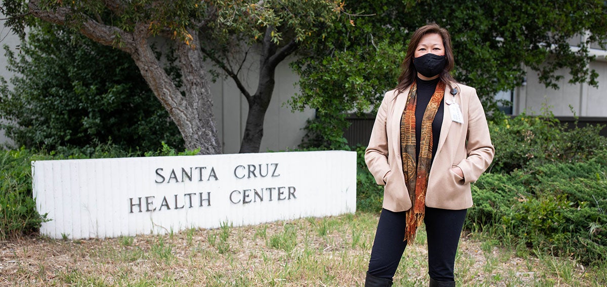 Santa Cruz County health services director Mimi Hall stands in front of the sign for the Santa Cruz County Health Center