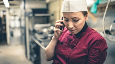 Chef taking a call on cellphone