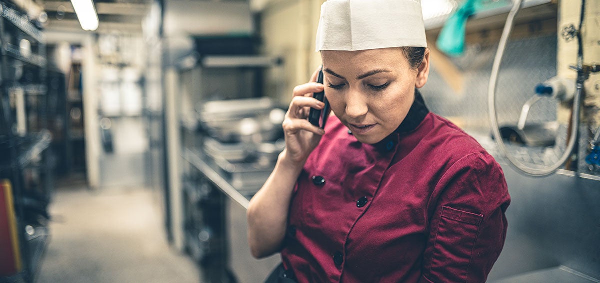 Chef taking a call on cellphone