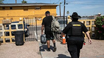 Constable evicts a tenant on October 7, 2020 in Phoenix, Arizona.