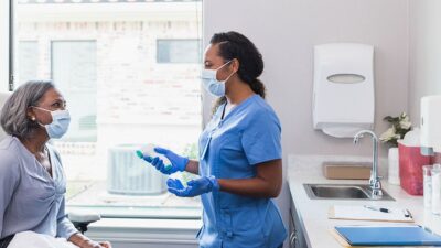 Nurse and patient in clinical setting