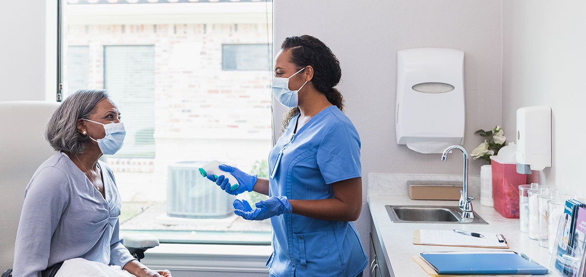 Nurse and patient in clinical setting