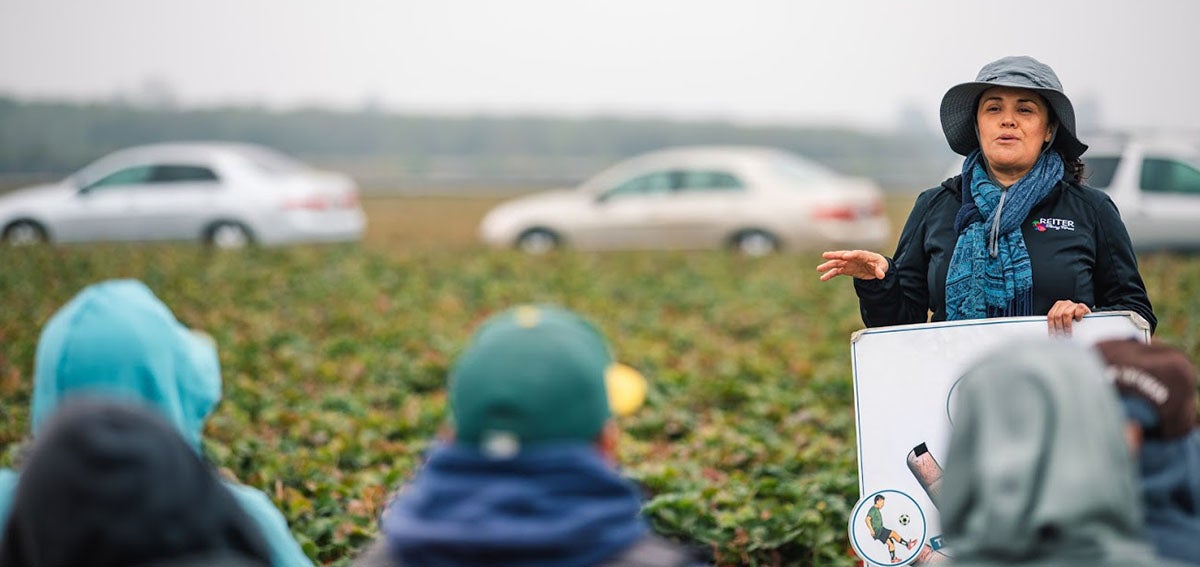 Community Health Worker, Marta Ortega provides health care information in an outreach program to harvesters in Watsonville.