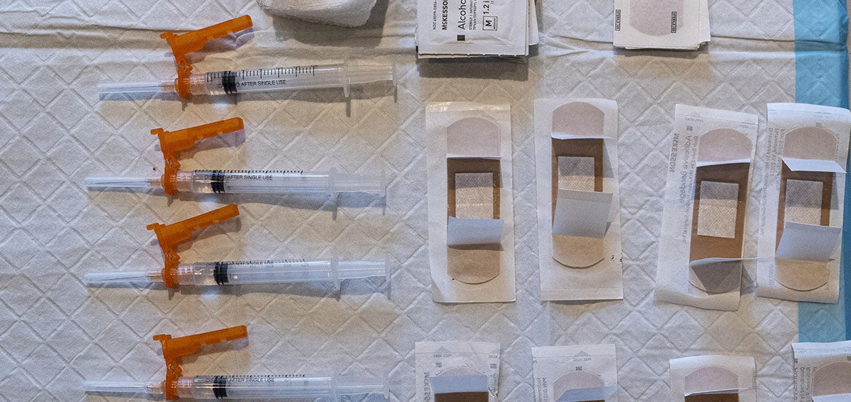 Syringes with prepared doses of the Johnson & Johnson Janssen Covid-19 vaccine and bandages