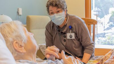Karen Ayers, a nurse practitioner, caring for a patient in Eureka, California