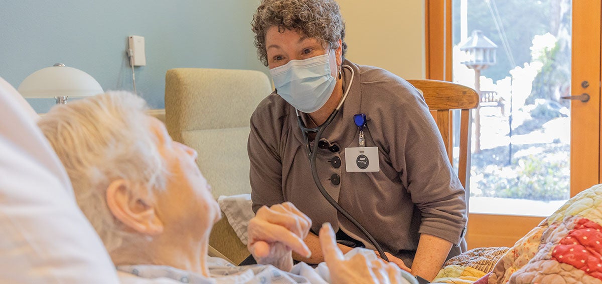 Karen Ayers, a nurse practitioner, caring for a patient in Eureka, California