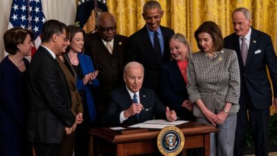 President Joe Biden signs an executive order.