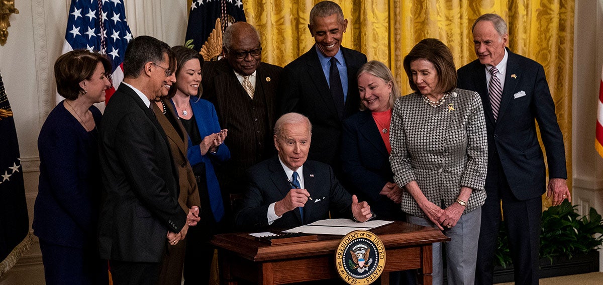 President Joe Biden signs an executive order.